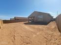 An expansive backyard showing a blank canvas with a block fence at 329 S San Christo Ln, Casa Grande, AZ 85194