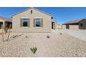 Inviting single-story house featuring shuttered windows, desert landscaping, and a tile roof at 329 S San Christo Ln, Casa Grande, AZ 85194