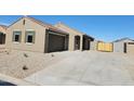 Charming single-story house featuring desert landscaping and a two-car garage at 329 S San Christo Ln, Casa Grande, AZ 85194