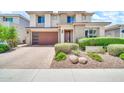 Attractive home featuring low maintenance landscaping, a two-car garage, and a welcoming front entrance at 3417 E Los Gatos Dr, Phoenix, AZ 85050