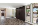 Inviting entryway featuring a double door entry, tiled flooring, and natural light from surrounding windows at 3512 S Elm St, Tempe, AZ 85282