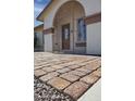 Charming gated front porch with tiled walkway leading to the front door at 3519 W Libby St, Glendale, AZ 85308