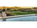 Gorgeous pool overlooking pristine golf course, desert landscaping and desert hills in the background at 4366 S Avenida De Angeles --, Gold Canyon, AZ 85118
