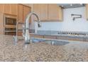 Beautiful island sink with stainless steel appliances at 4822 W Owl Head Pl, San Tan Valley, AZ 85144