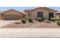 Charming single-story home featuring a well-maintained front yard with desert landscaping at 5919 W Straight Arrow Ln, Phoenix, AZ 85083
