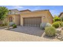 Home featuring a brick-paved driveway and a two-car garage at 6231 E Mark Way # 14, Cave Creek, AZ 85331
