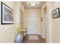 Inviting foyer with hardwood floors, an arched doorway, and elegant decor at 6231 E Mark Way # 14, Cave Creek, AZ 85331