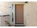 Welcoming entry with a neatly painted door, small window, and decorative cactus at 7101 W Beardsley Rd # 542, Glendale, AZ 85308