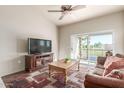 Comfortable living room featuring a balcony with a scenic view and a plush couch at 7101 W Beardsley Rd # 542, Glendale, AZ 85308
