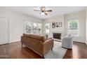Inviting living room with a fireplace, hardwood floors, and ample natural light at 725 W Portland St, Phoenix, AZ 85007