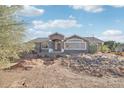 Charming single-story home with desert landscaping, rocks, and a welcoming entrance at 8343 W Calle Lejos --, Peoria, AZ 85383
