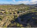 Expansive aerial view of a residential area surrounded by mountains and desert landscape at 14594 E Corrine Dr, Scottsdale, AZ 85259