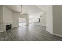 Bright living room with fireplace and sliding glass door leading to the backyard at 15360 N 87Th Ave, Peoria, AZ 85381