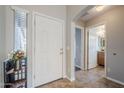 Bright foyer featuring tile flooring, neutral paint, and views into the hallway and bathroom at 3649 E Hazeltine Way, Chandler, AZ 85249