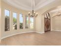 Bright living room featuring recessed lighting, arched windows, and a chandelier at 402 E Windmere Dr, Phoenix, AZ 85048