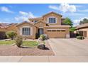 Charming two-story home with well-manicured lawn, desert landscaping, and an inviting facade at 4976 E Thunderbird Dr, Chandler, AZ 85249