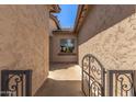 Exterior shot showcasing the gated side yard featuring well-maintained stucco walls at 5541 W Desperado Way, Phoenix, AZ 85083
