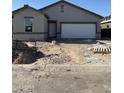 New single-story home in progress with garage, front door, and dirt landscaping at 6036 E Artemis Dr, Florence, AZ 85132