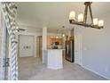 Open-concept layout with a view of the kitchen, adjacent living room, and dining area at 1831 S Hudson Dr, Chandler, AZ 85286