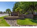 Landscaped entrance to Chesapeake Condominiums, a quiet community featuring manicured grounds and mature trees at 200 E Southern Ave # 226, Tempe, AZ 85282