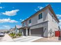 Contemporary two-story home with a two-car garage, clean lines, and thoughtfully designed landscaping at 21134 W Minnezona Ave, Buckeye, AZ 85396