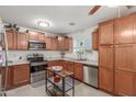 Well-equipped kitchen featuring wooden cabinets, stainless steel appliances, and ample counter space at 22578 E Sahara Dr, Florence, AZ 85132