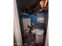 Damaged bathroom with broken ceiling, debris, and outdated fixtures at 3308 W Missouri Ave, Phoenix, AZ 85017