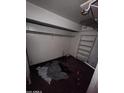 Empty closet featuring shelving, rack for hangers, and dark floors at 3308 W Missouri Ave, Phoenix, AZ 85017