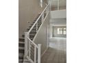 New home features staircase with gray carpet, white risers, and silver horizontal railings at 3354 S 180Th Ln, Goodyear, AZ 85338