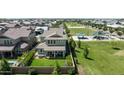 Aerial view of backyard, lawn, and neighborhood park nearby at 3818 E Appaloosa Rd, Gilbert, AZ 85296