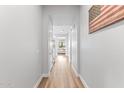 Bright hallway with wood floors leading to a living room at 3818 E Appaloosa Rd, Gilbert, AZ 85296