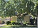 Charming single-Gathering home featuring mature trees, manicured lawn, and attractive landscaping at 4109 E Sierra Madre Ave, Gilbert, AZ 85296