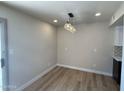Dining room with hardwood floors, modern light fixtures and bright natural light at 4228 N 81St St, Scottsdale, AZ 85251