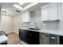 Modern kitchen featuring stainless steel dishwasher, ample cabinets, and stylish backsplash at 4228 N 81St St, Scottsdale, AZ 85251
