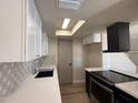 Bright kitchen features white cabinets, stainless steel appliances, and modern backsplash at 4228 N 81St St, Scottsdale, AZ 85251