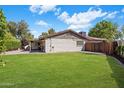 Expansive backyard with lush lawn at 502 W Port Royale Ln, Phoenix, AZ 85023