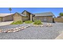 Beautiful single-Gathering home boasts a landscaped front yard, enhancing its curb appeal and welcoming ambiance at 5424 E Florian Ave, Mesa, AZ 85206