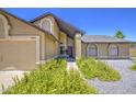 Inviting single-Gathering home with a neatly landscaped yard and a welcoming front entrance. Lush greenery adds charm at 5424 E Florian Ave, Mesa, AZ 85206