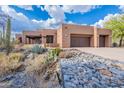 Stunning desert home with a private drive and xeriscaped landscaping at 5892 E Carefree Mountain Dr, Carefree, AZ 85377