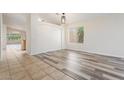 Bright living room featuring tiled and wood-style flooring with natural light at 10226 E Pine Valley Rd, Scottsdale, AZ 85255