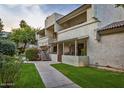 A charming two-story condo with a private patio and green lawn, located in a desirable community at 11026 N 28Th Dr # 34, Phoenix, AZ 85029