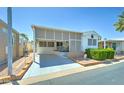 Charming single-story home with a covered patio and well-maintained landscaping at 111 S Greenfield Rd # 467, Mesa, AZ 85206