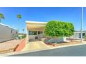 Inviting home featuring well-maintained landscaping, driveway and covered parking at 111 S Greenfield Rd # 531, Mesa, AZ 85206