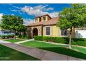 Inviting home showcasing well-maintained landscaping, mature trees, and a classic facade at 1134 S Lydia Ln, Gilbert, AZ 85296