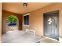 Welcoming front porch with neutral tones, ample space, and a cozy seating area at 1134 S Lydia Ln, Gilbert, AZ 85296