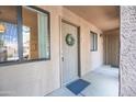 Apartment building entryway with decorative wreath hanging on the door at 1287 N Alma School Rd # 171, Chandler, AZ 85224