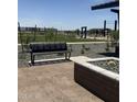 Scenic park bench amidst landscaped surroundings, perfect for relaxation and enjoying the outdoor community space at 15509 W Corte Del Sol Este --, Waddell, AZ 85355