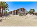 Inviting exterior view of a charming two-story home with desert landscaping and a two-car garage at 1914 S Brooks Cir, Mesa, AZ 85202