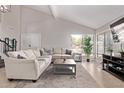 Bright living room features high ceilings, tile floors, large windows and a cozy sofa at 1914 S Brooks Cir, Mesa, AZ 85202