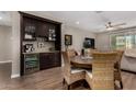 Inviting dining area featuring a built-in bar, wine cooler, and stylish decor at 2023 W Yellowbird Ln, Phoenix, AZ 85085